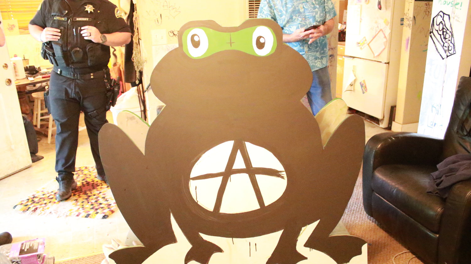 This is the cutout frog allegedly stolen last year from the nearby Frog Pond Grocery, found inside the house on June 4, 2021.