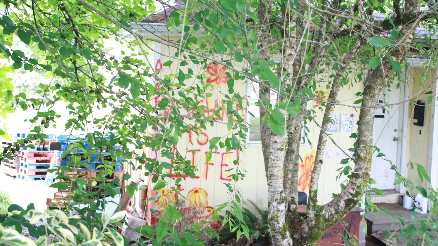 "Resistance is life" reads some of the graffiti on the house's exterior on June 4, 2021.