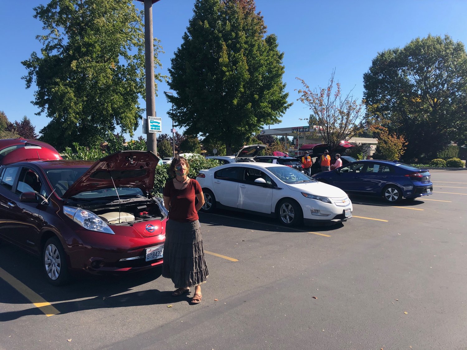 Carrie Ziegler, community engagement organizer for Thurston Climate Action Team, showed off her Nissan Leaf at her organization's flash mob gathering on Sat., Sept. 25, 2021.