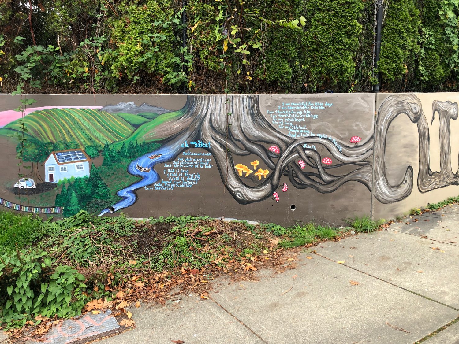 Both Lushootseed and English versions of the Native American prayer are shown in this image of the Climate Justice Wall in west Olympia.
