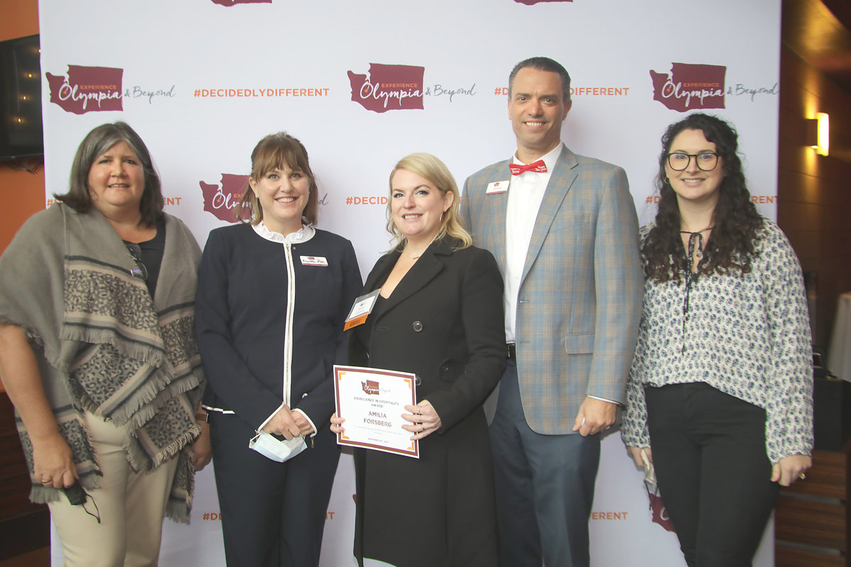 Amilia Forsberg, general manager of Chelsea Farms Oyster Bar, won the Excellence in Hospitality Award from Experience Olympia & Beyond at the organization's annual meeting on Nov. 18, 2021. She is surrounded by the EO&B's staff, l-r, Kelly Campbell, VP of Finance and Administration; Annette Pitts, CEO; Jeff Bowe, VP of Sales & Development; Aly Laris, Director of Marketing.