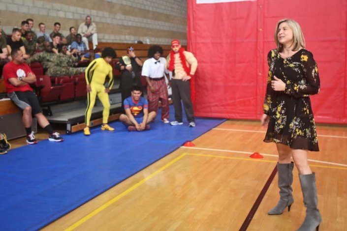 In 2014, Meredith Lozar served as the director of the Navy and Marine Corps Relief Society at Camp Pendleton, California. Here she speaks to Marines during a dodgeball fundraising tournament to increase awareness for the organization and raise funds.