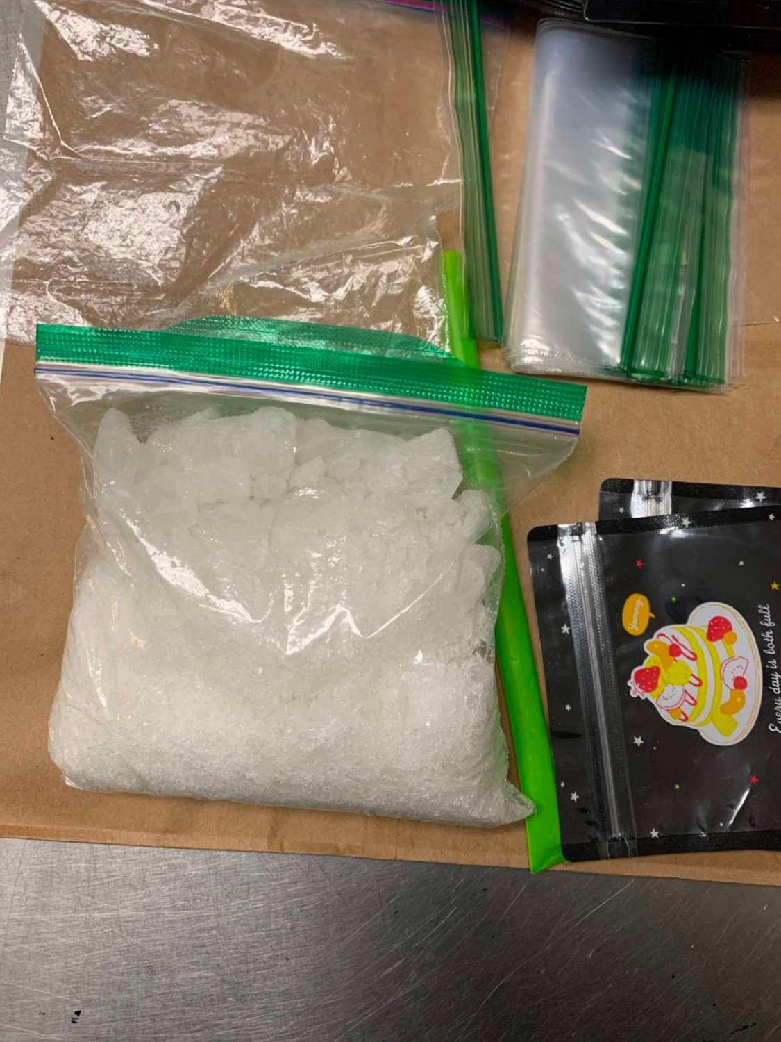 Police said methamphetamine, empty Ziplock bags, a black scale, and a large quantity of cash were recovered from the suspect.