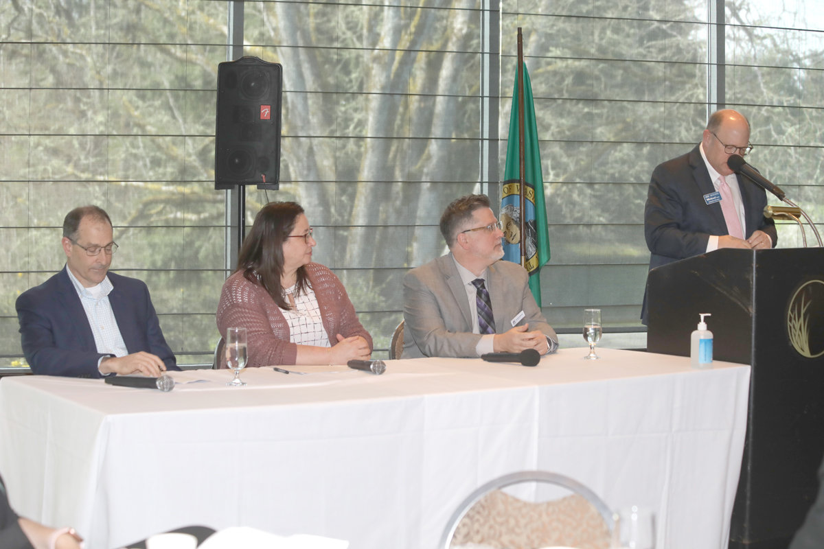 Panelists at the Workforce Symposium included, l-r, David Schaffert, Amy Warren, and William Westmoreland. Michael Cade, executive director of the Thurston Economic Development Council, right, moderated the event.
