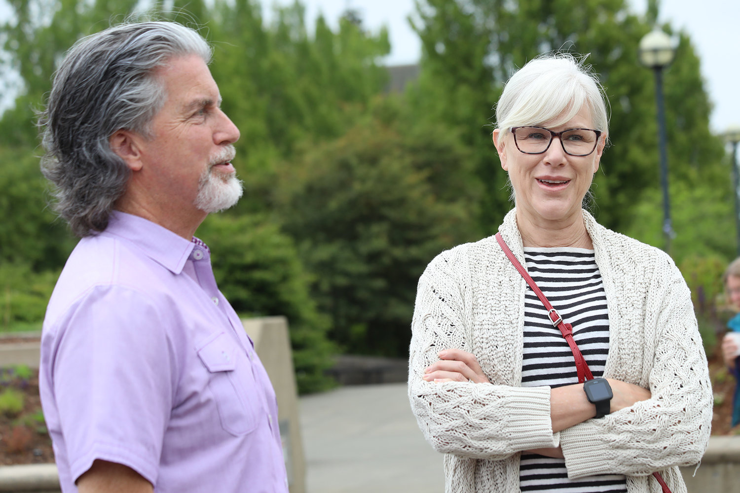 Kevin Pierce speaks with Olympia Mayor Cheryl Selby at the opening of the Capitol Campus Pollinator Garden on June 22, 2022.