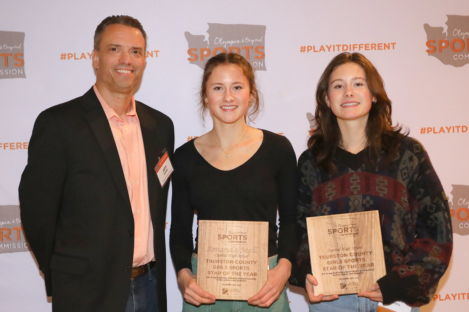 Olympia and Beyond's Jeff Bowes with Track and Field Sports Stars of the Year Amanda and Hana Moll of Capital High School.