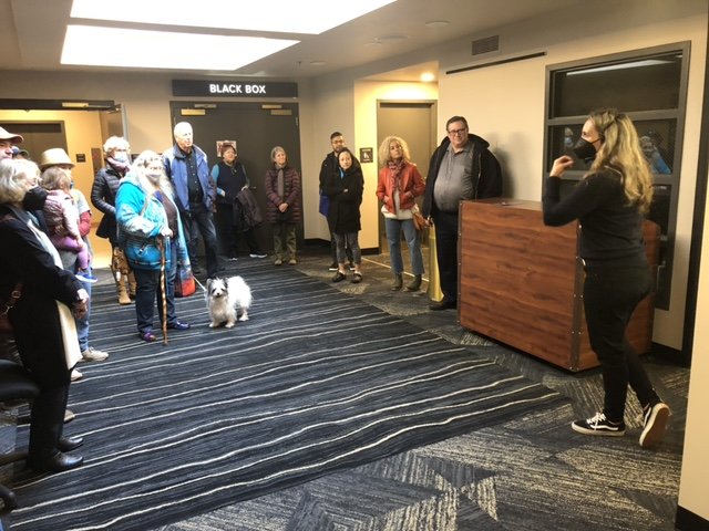 The Washington Center's executive director, Jill Barnes (right) addresses a tour of visitors to the newly re-opened - and re-carpeted - facility on November 12, 2022.